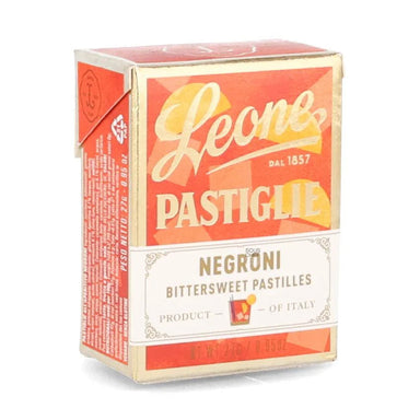 A small rectangular box of Leone Negróni bittersweet pastilles, featuring a red and cream design with the brand name 'Leone' in large script.