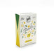 Sabadi Le Caramelle lemon balm tea box, featuring a white front with yellow illustrations of lemons, green leaves, and a cute cartoon character, set against a plain white background.
