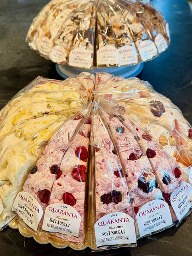 Quaranta soft nougat display with various flavors on a table.
