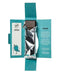 A packaged chocolate bar presented in an open teal paper sleeve with printed text panels on both sides. The chocolate is wrapped in reflective silver foil, and the brand name 'TRITONE' is visible on the left panel.